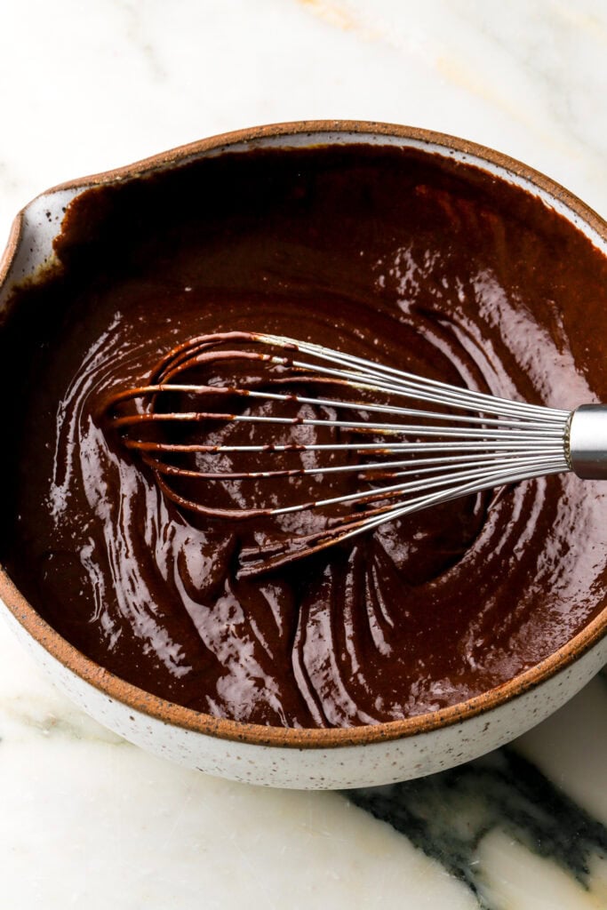 melted butter and chocolate added to whisked eggs