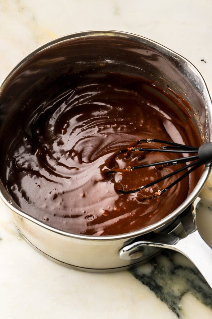 powdered sugar and milk mixed into frosting