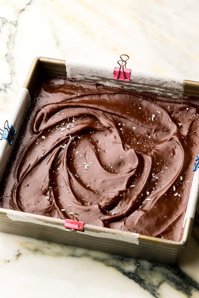 finished frosting spread on top of cookie bars and topped with flakey salt