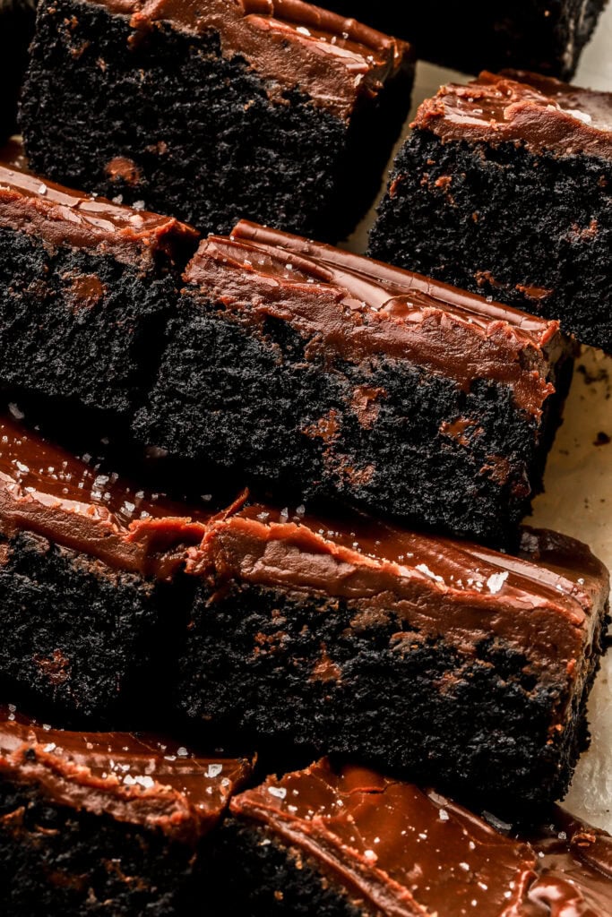 close up of texture of the inside of frosted black cocoa cookie bars