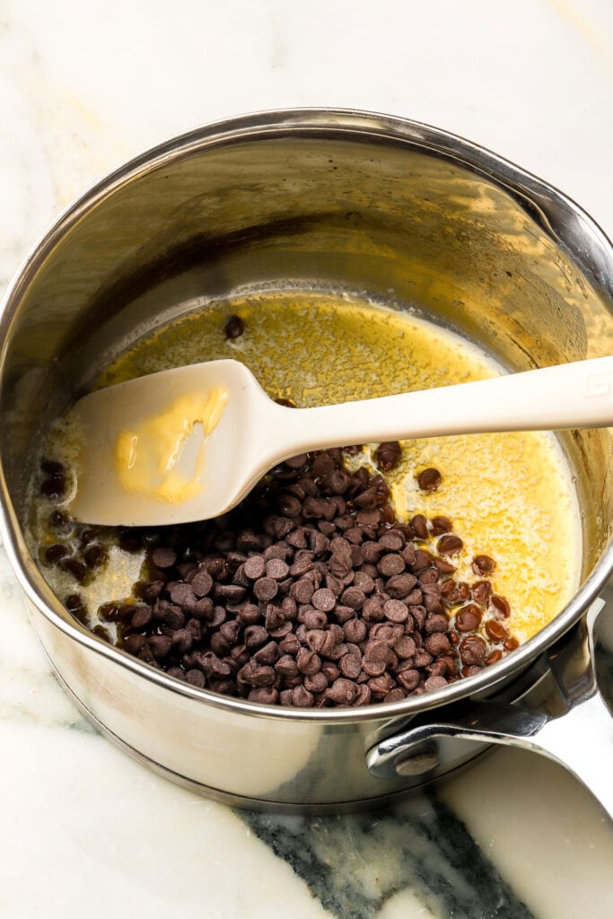 melted butter and chocolate chips in saucepan
