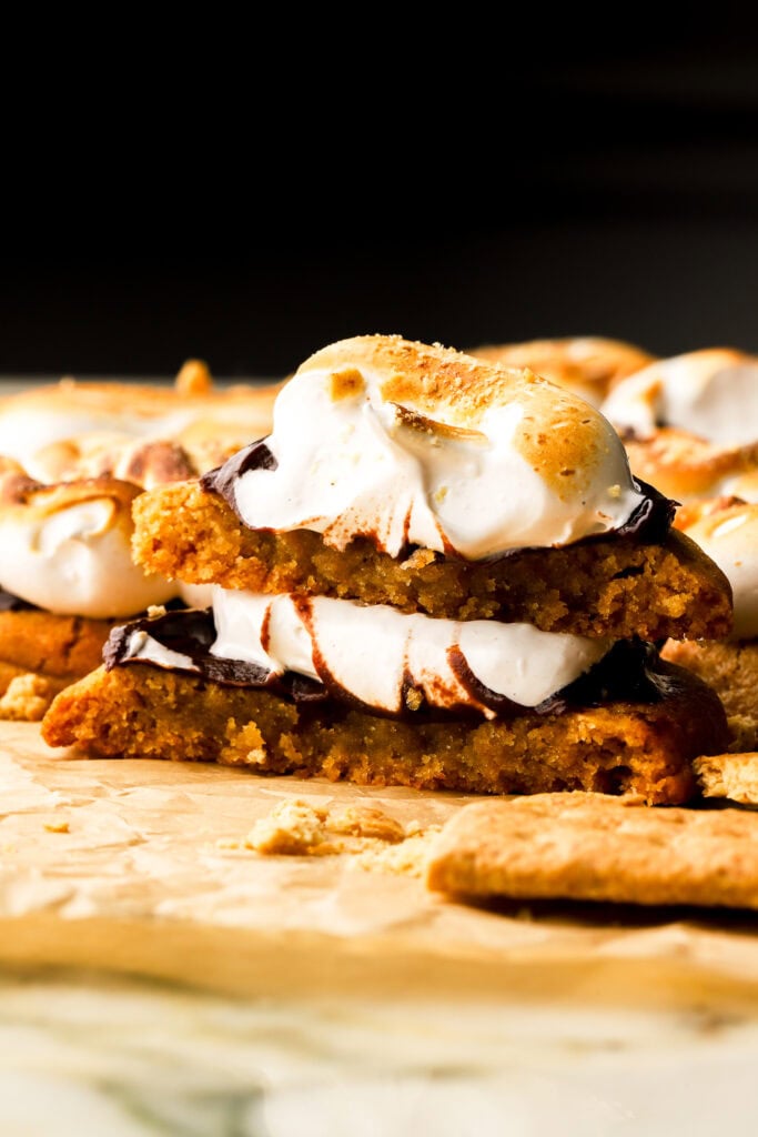 frosted s'mores cookie torn in half and stacked