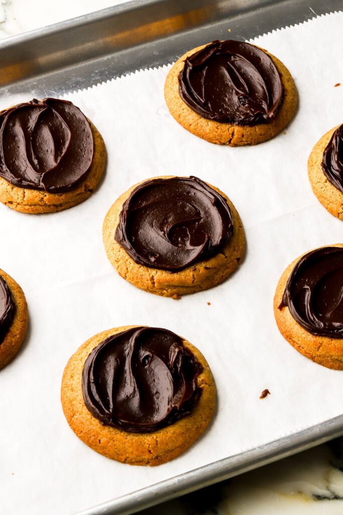 chocolate ganache spread onto cookies