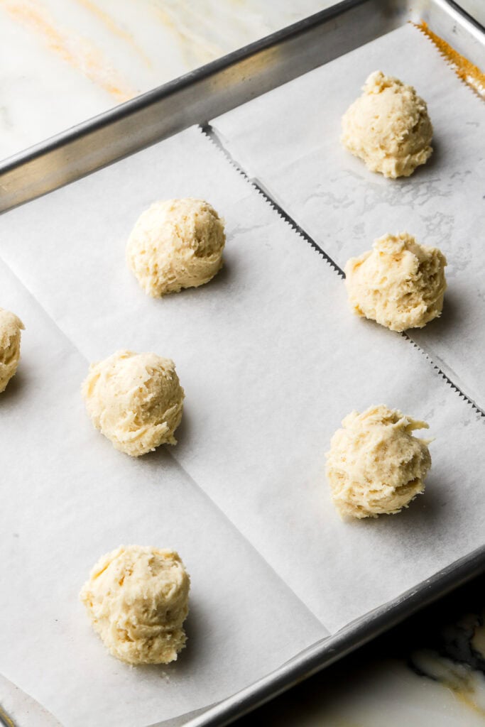 Cookie dough scooped onto cookie sheet