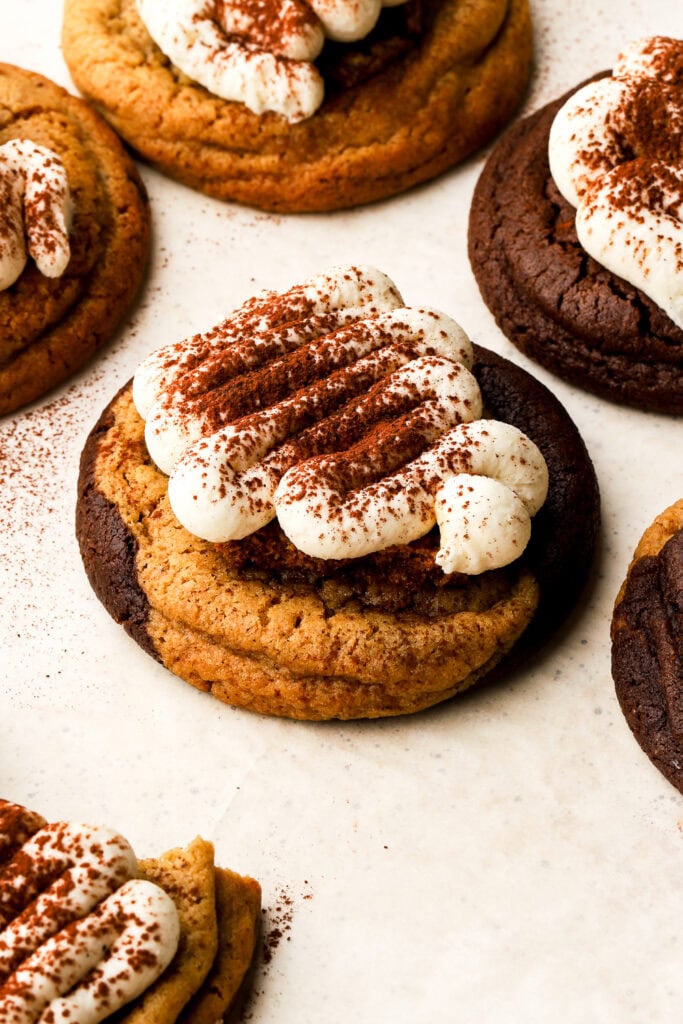 marbled tiramisu cookie frosted with mascarpone frosting and dusted with cocoa powder