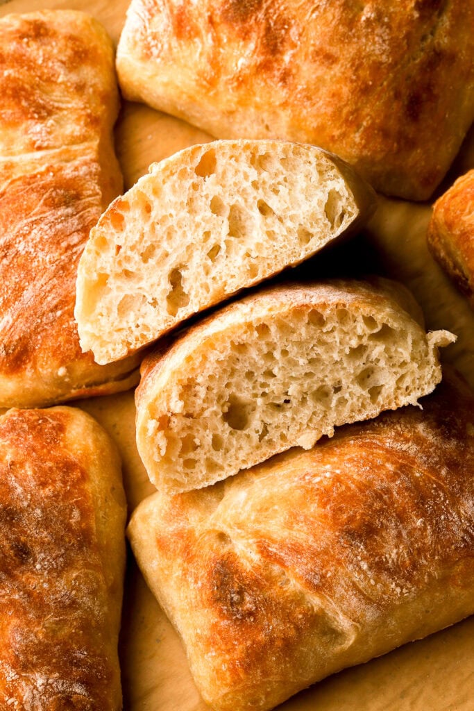 ciabatta bread sliced in half to show the inside crumb texture