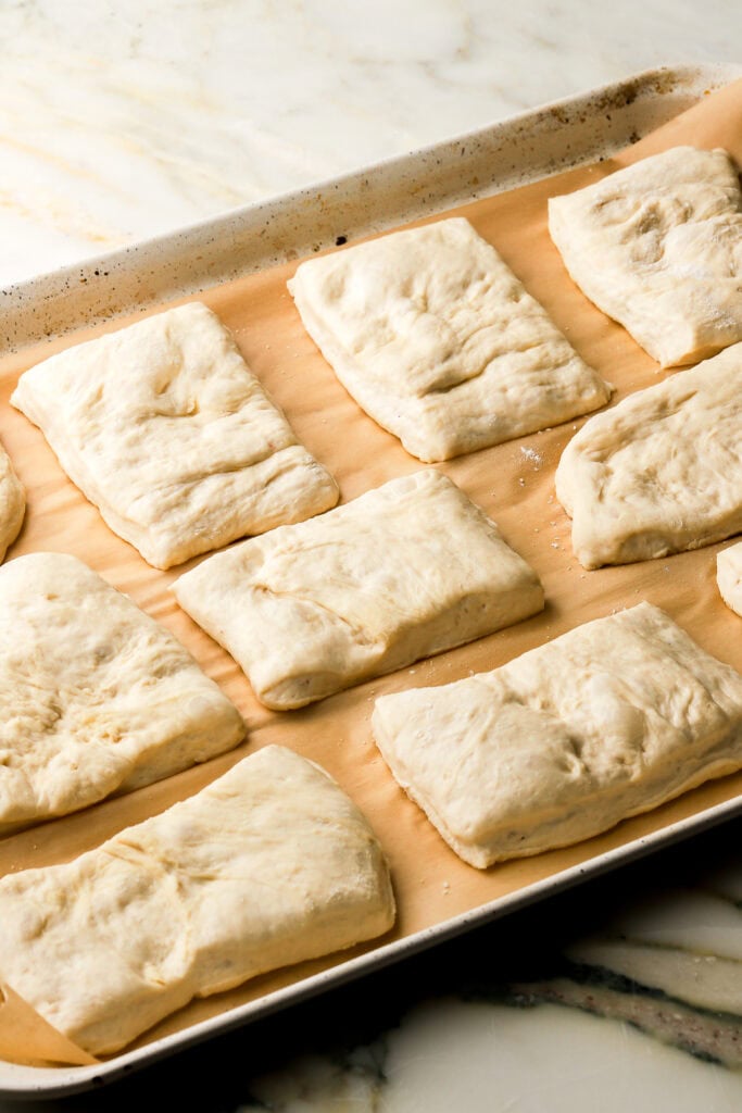 ciabatta dough on prepared pan after second proof