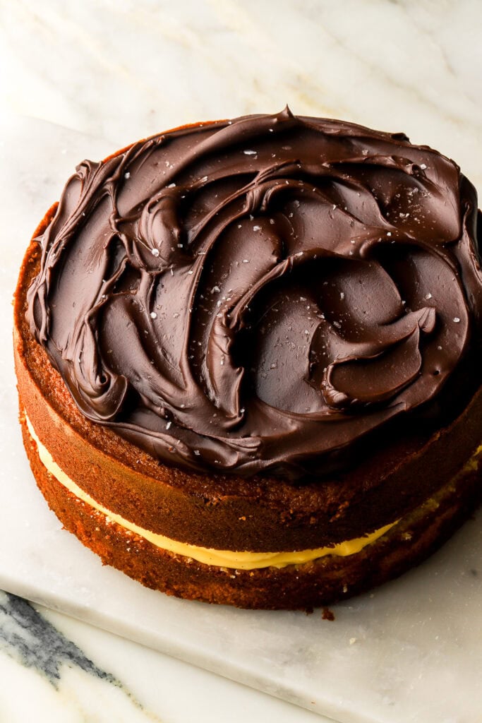 chocolate ganache swirled on top of the cake