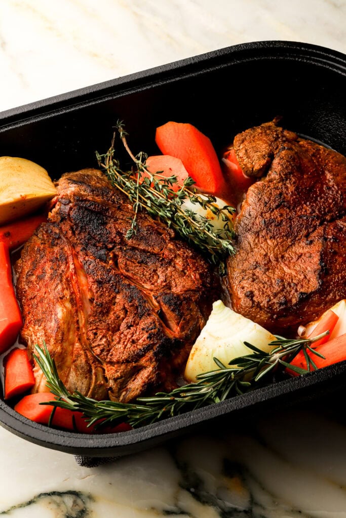 beef ready to go in the oven with vegetables and broth