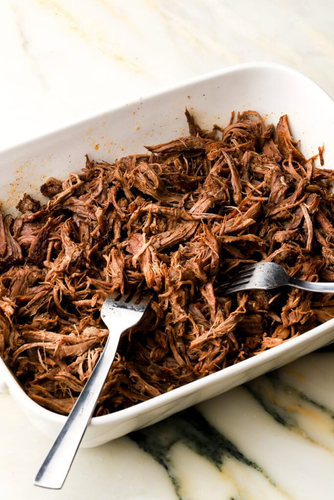 Beef shredded with forks in the serving dish