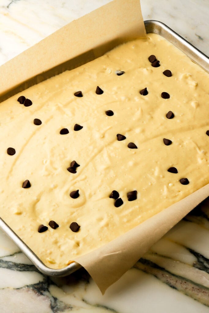 cottage cheese pancake batter in a sheet pan with chocolate chips