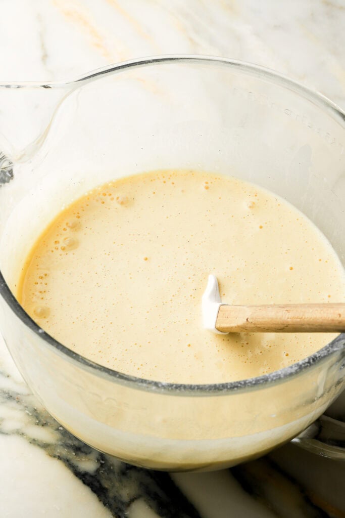 Finished cake batter in the mixer bowl with the spatula