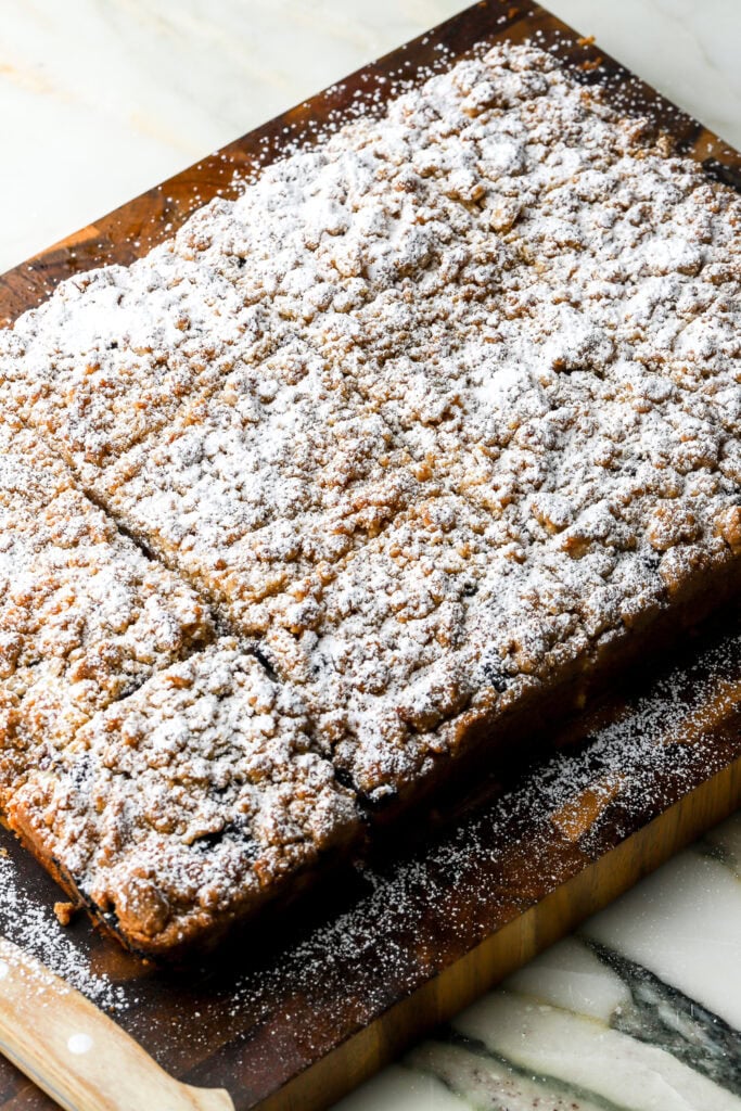 coffee cake sliced and topped with powdered sugar