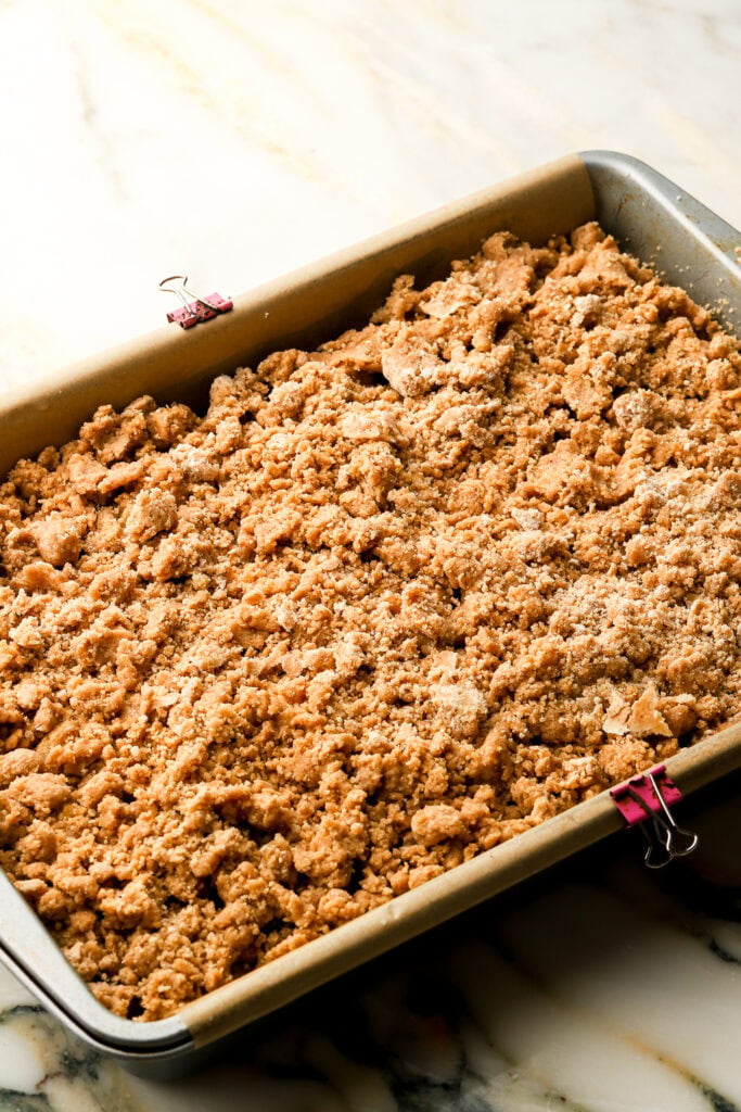 coffee cake topped with streusel in prepared pan before baking