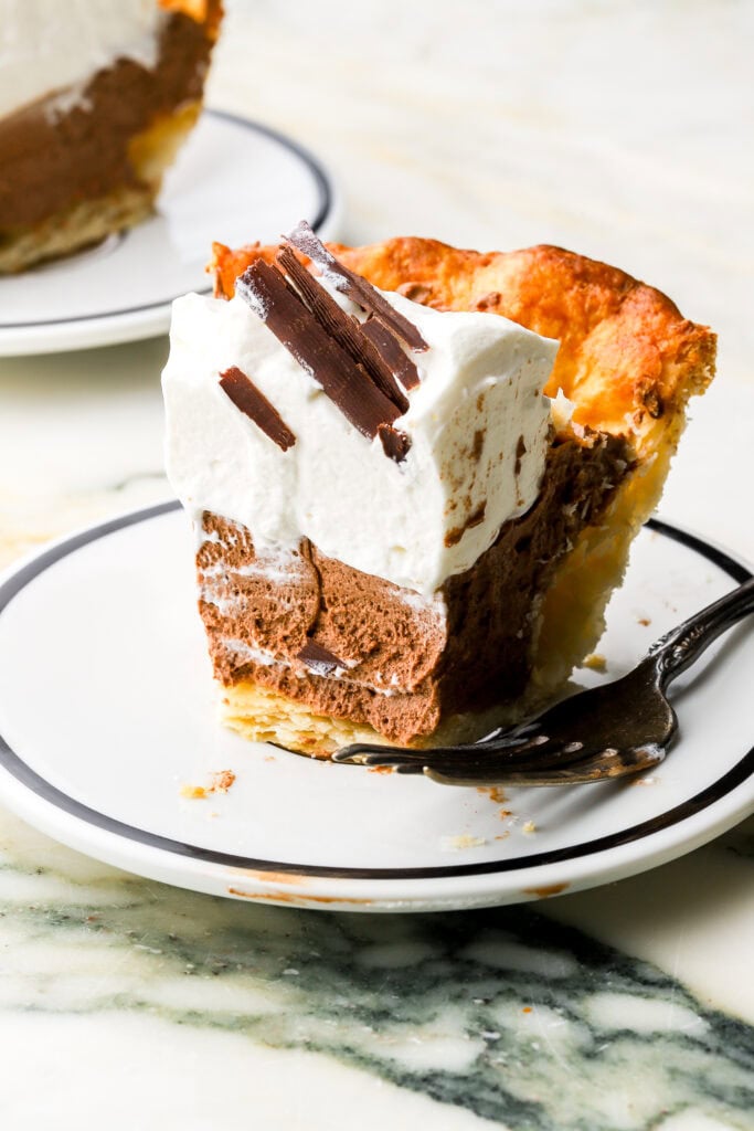 close up of a slice of french silk pie with a bite taken out