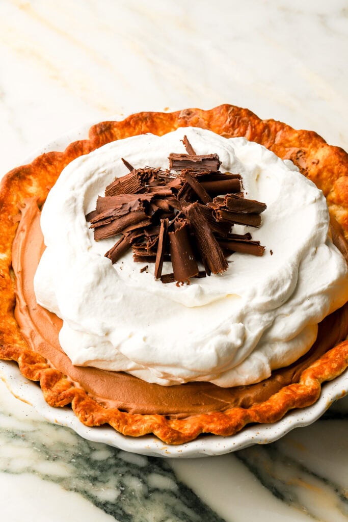 french silk pie complete with whipped cream and chocolate shavings