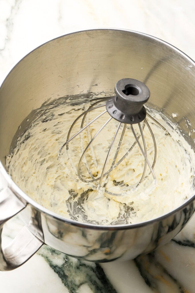butter and sugar beat for a 10 minutes in a stand mixer with the whisk attachment until pale