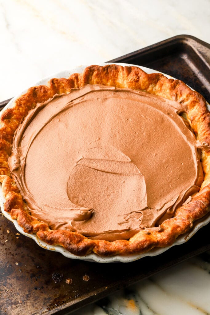 chocolate mixture spread into blind baked pie crust