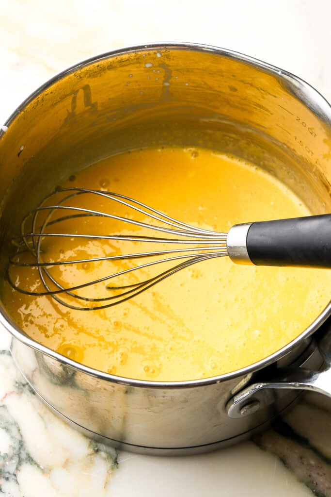 egg yolks and sugar whisked together in a saucepan with a whisk