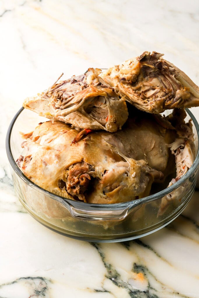 cooked chicken on the bone, in a bowl