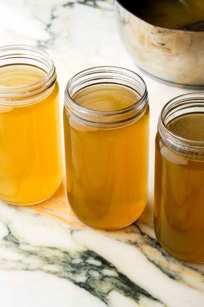 chicken soup/broth stored in glass containers