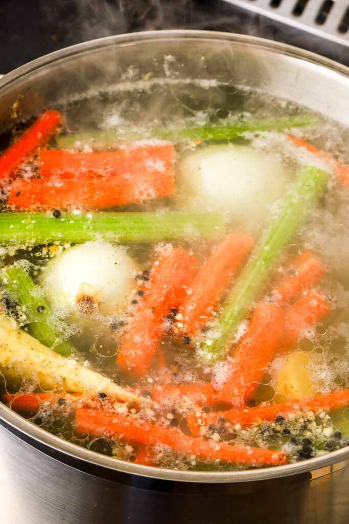 foam removed and soup coming to a boil.