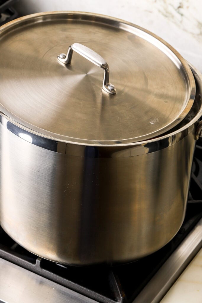 simmer the soup with the lid on top with a crack open