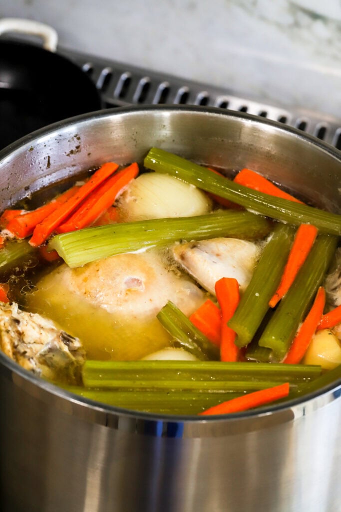 foam removed off the surface of the soup, while simmering on the stove