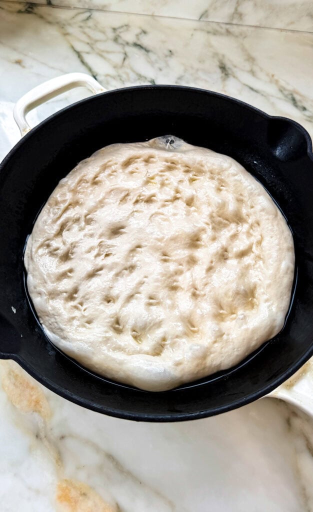 dough in prepared pan, fully dimpled out