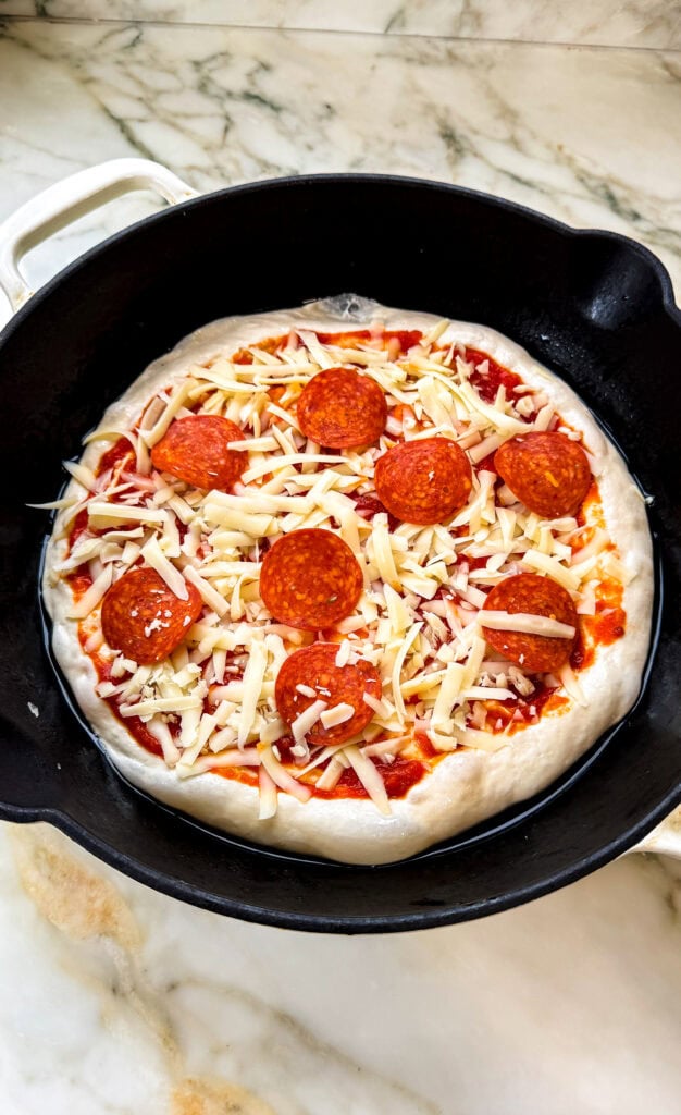 pan pizza topped with toppings and cheese