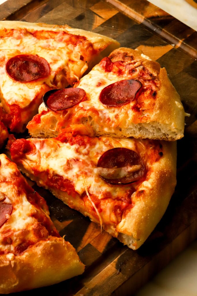 pan pizza sliced showing side profile of crust