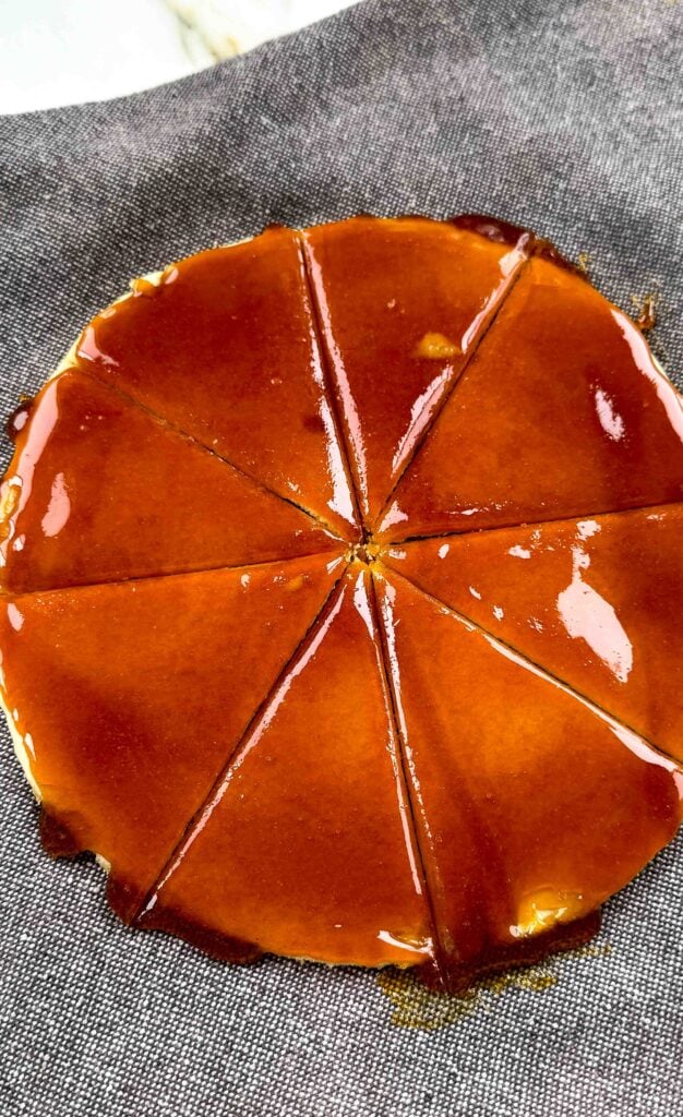 sugar poured on top of last layer of cake and scored with a knife