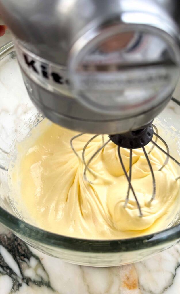 egg yolks and sugar whipped in the glass bowl of a stand mixer with the whisk attachment until it holds streaks and ribbons