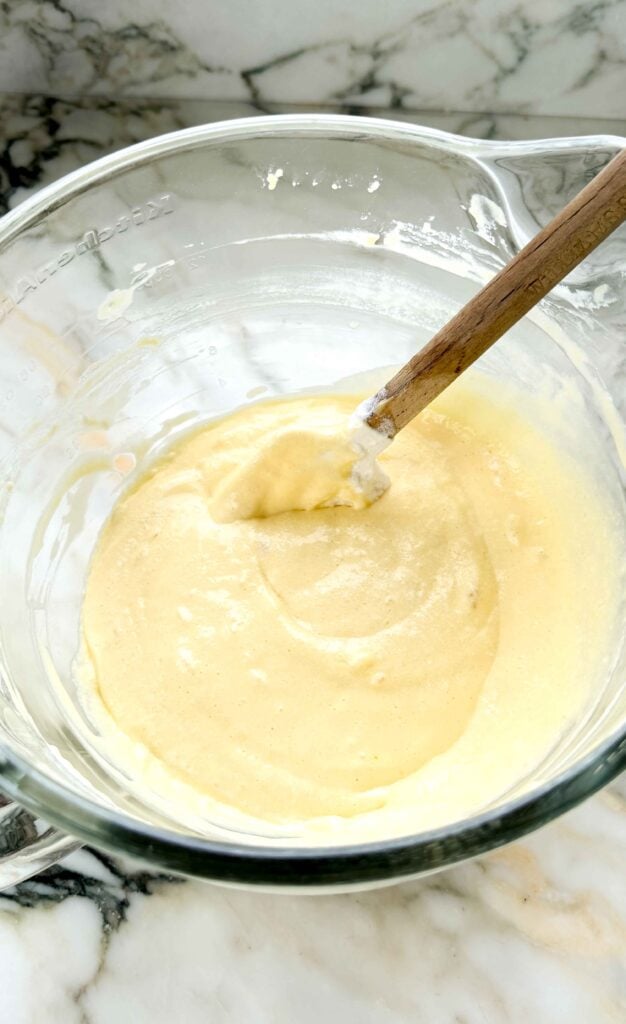 finished batter in the glass bowl of a stand mixer