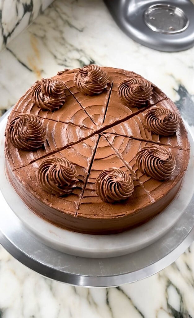 cake assembled with chocolate buttercream and piping details on top