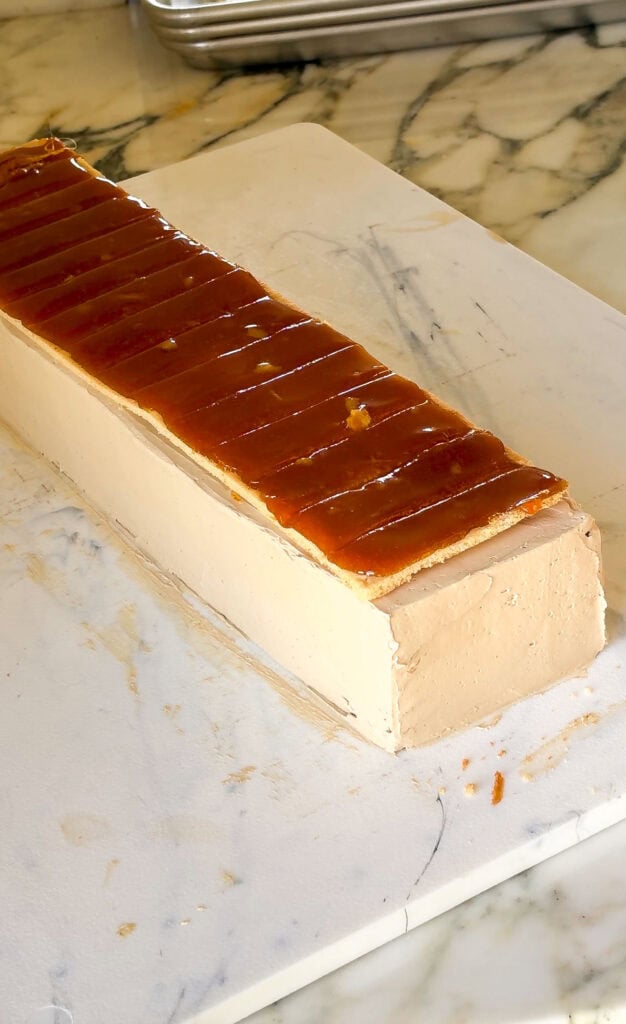 Last layer with the caramel on top of the frosted cake 