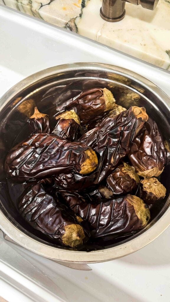 eggplants roasted and charred, in a bowl